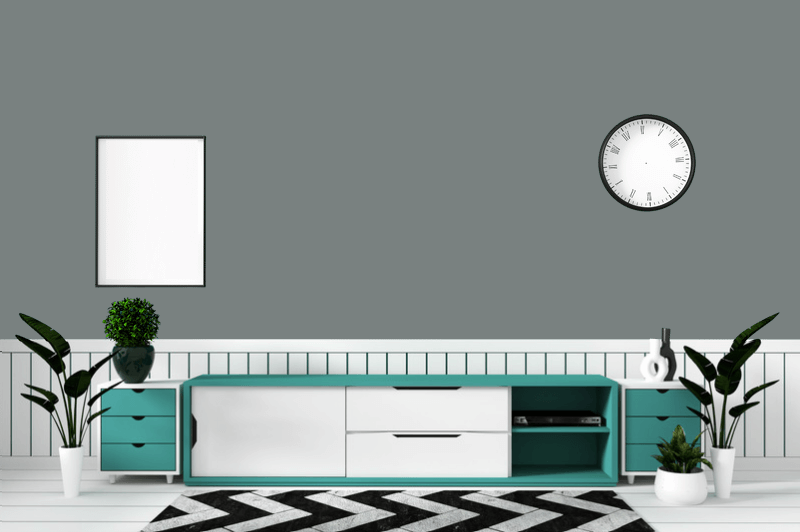 The color stonybrook on a wall that is half white beadboard, in a living room behind a black and white zig zag rug and a green and white console table.