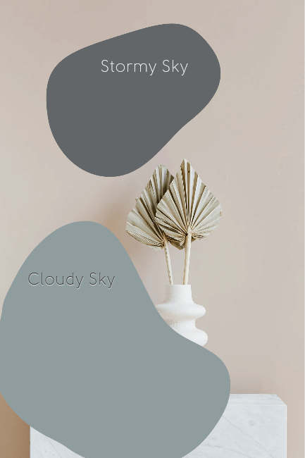 Cloudy sky vs stormy sky, paint bubbles over a modern beige background with gold faux leaves in a vase.