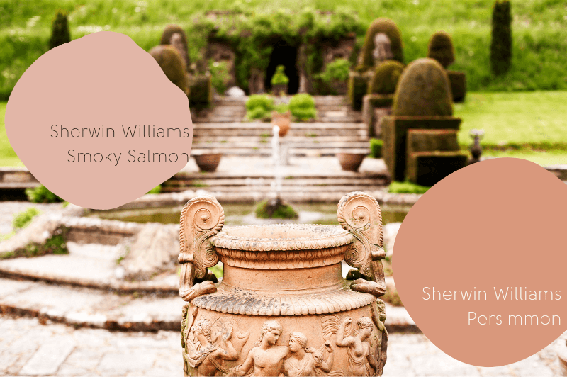 Faded light terracotta pot in front of a palace garden with fountains. Paint swatches read "Sherwin williams smoky salmon" and "Sherwin Williams Persimmon."