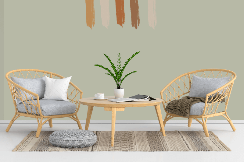 October mist on the wall in a living room behind a rattan table with two matching chairs and neutral colored rug and accessories