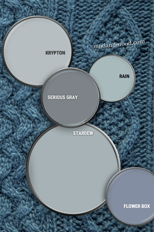 Paint can lids with paint on them arranged on a sweater background with. Labelled colors from top to bottom are Krypton, Rain, Serious Gray, Stardew, and Flower Box.
