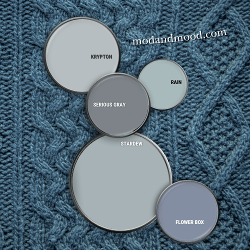 Paint can lids with paint on them arranged on a sweater background with. Labelled colors from top to bottom are Krypton, Rain, Serious Gray, Stardew, and Flower Box.