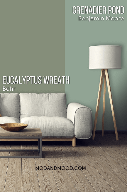 Behr Eucalyptus Wreath on half of a wall and benjamin moore grenadier pond on the other half behind a beige sofa.
