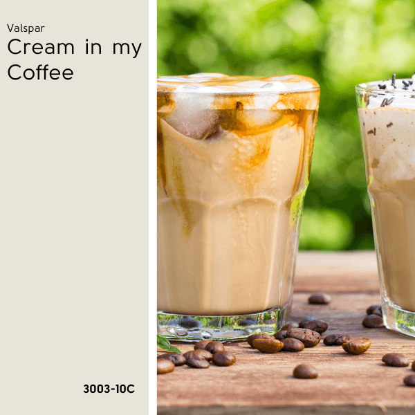 Swatch of Valspar's Cream in my coffee beside two creamy iced coffees on a butcher block table outside that is scattered in coffee beans.