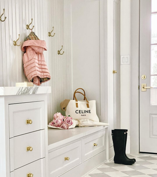 A classic look from Repose gray on cabinets in a front entrance.
