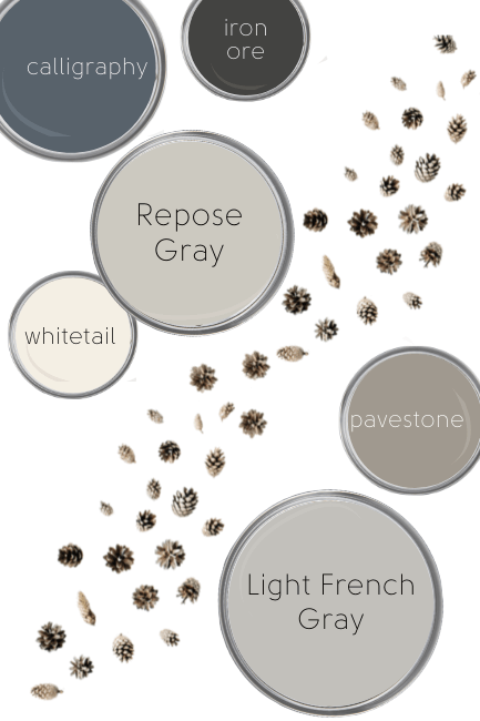 Repose gray, light french gray, calligraphy, iron ore, pavestone, and whitetail all on paint lids scattered on a white background with pine cones trailing through them.