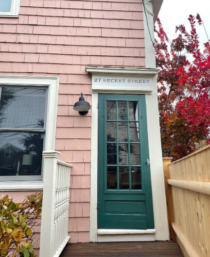 Tarrytown Green Door with Monticello Pink Siding on a home exterior