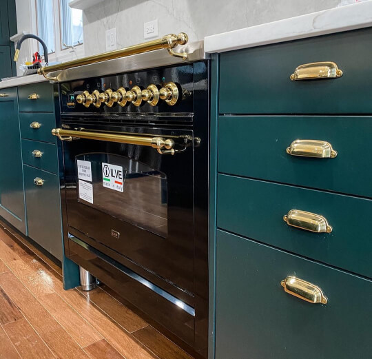 Benjamin moore Black Forest Green on kitchen cabinets with gold hardware