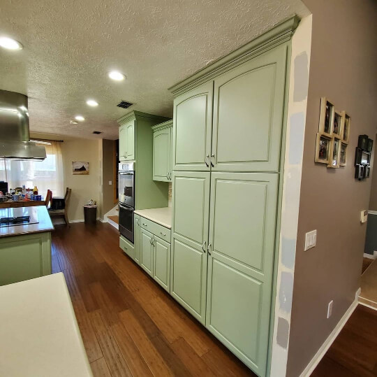 Clary Sage looking warmer on kitchen cabinets with warm colored floors