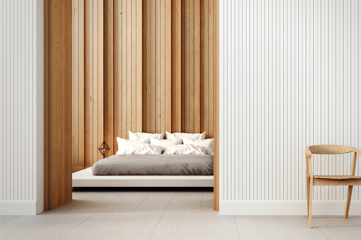 White panelled wall and one natural wood panelled wall