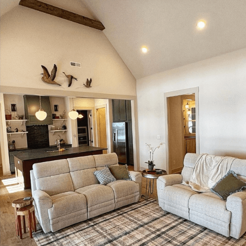 Accessible beige trim with Shoji White walls in a hunting lodge style home.