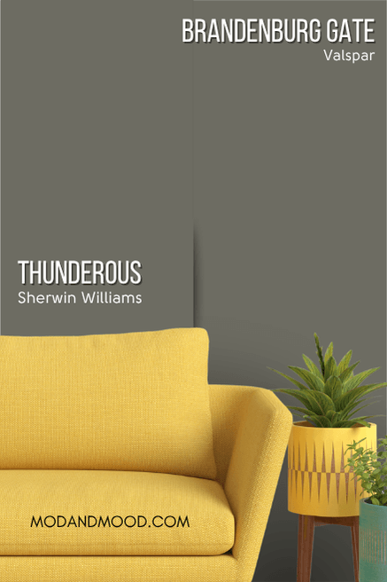 Sherwin Williams Thunderous on a wall beside dupe Brandenburg Gate. A mustard couch sits in front.