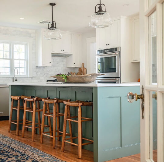 A SW Rosemary Island with White Flour wall Cabinets