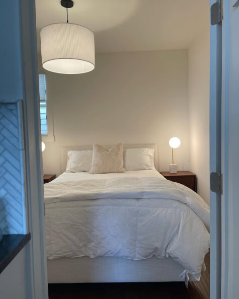 Sherwin Williams White Flour in a bedroom with white bedding