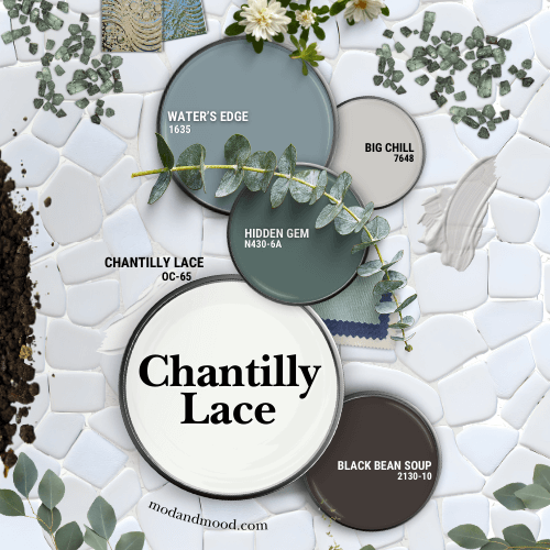 Benjamin Moore Chantilly Lace with coordinating colors Water's Edge, Big Chill, Black Bean Soup, and Hidden Gem. All colors are swatched on paint lids, over a background of white pebble tiles with white grout, and scattered greenery, crystals, and tiles, all in coordinating colors.