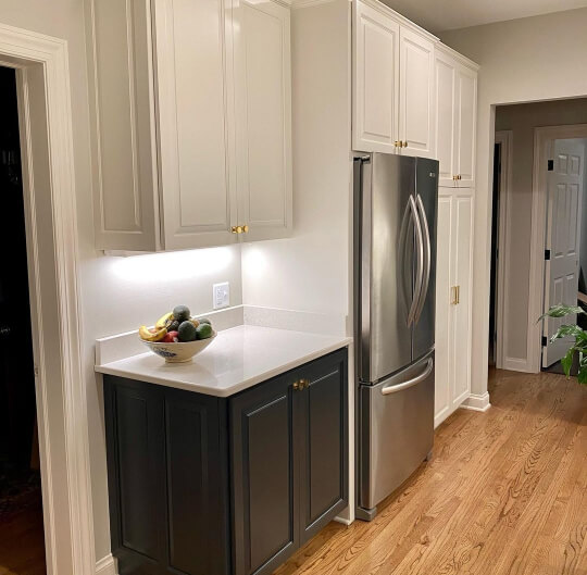 Cyberspace on lower cabinets and Sherwin williams creamy on the upper ones.