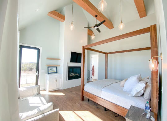 Sea salt in airy bedroom with beams and a 4 poster bed