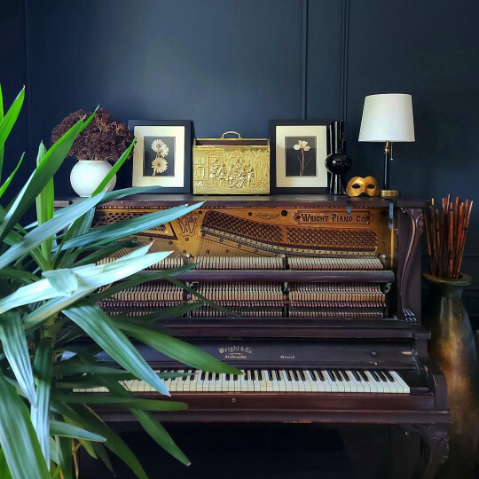 Dark academia Hale Navy Victorian living room behind a piano