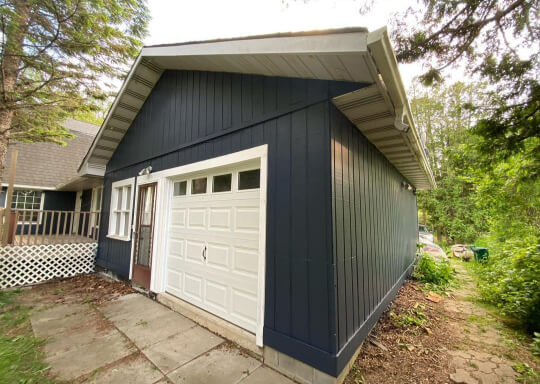 Hale navy exterior with white garage door and trim
