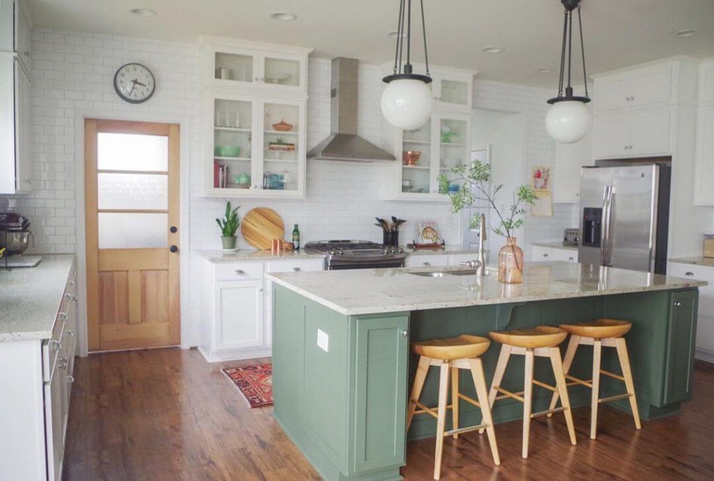 Rosemary island in a white kitchen with wood bar stools
