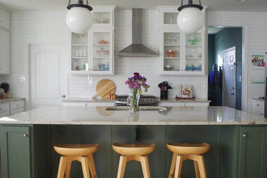 Rosemary island in a white kitchen with wood bar stools