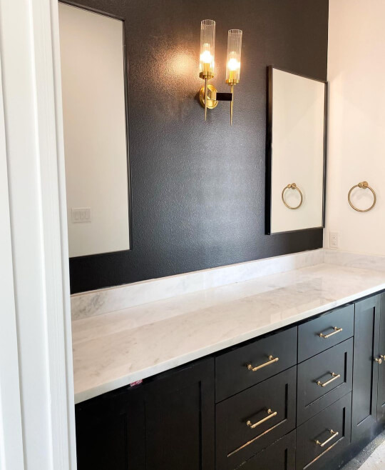 Tricorn black wall with mirrors and black vanity