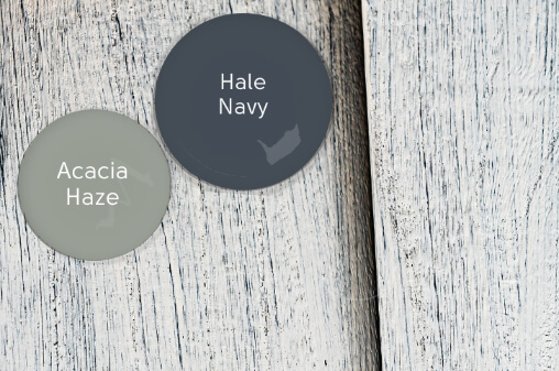 Coordinating Colored Paint drop of Acacia Haze over a whitewashed board with a drop of Hale Navy