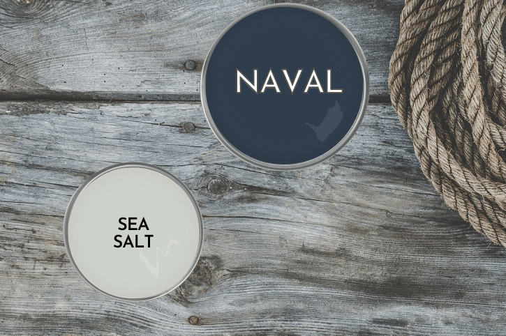 Swatch of Naval on a paint lid beside a paint lid of sea salt on a wood dock with ropes