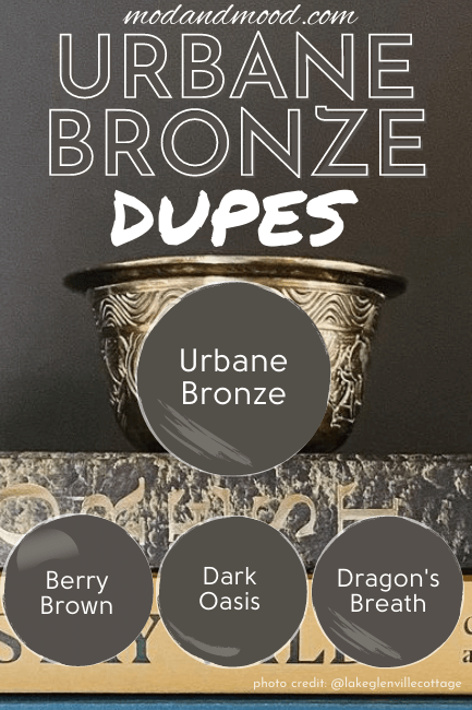 Dupes for Urbane Bronze from Benjamin Moore, Valspar, and Behr over a photo of Urbane Bronze builtin with stack of books and bronze cup. Colors are Berry Brown, Dragon's breath, and Dark Oasis