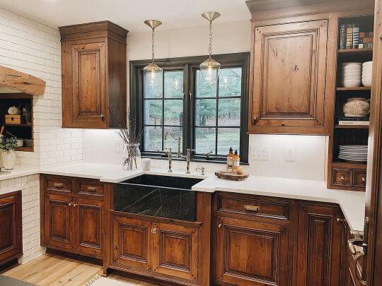 Greenblack interior trim kitchen window with wood cabinets