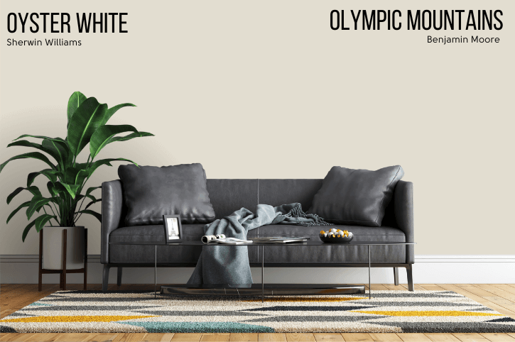 Benjamin Moore Oyster White Dupe Olympic Mountains beside Oyster White on a wall behind a gray leather sofa