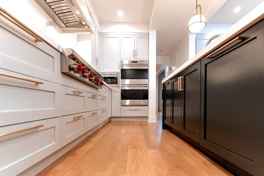 Closeup of Iron Ore on a kitchen Island with white countertop and repose gray perimeter cabinets
