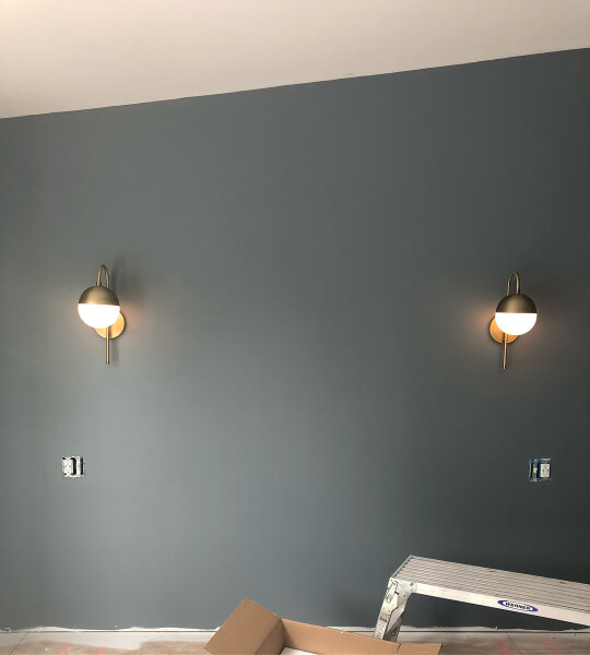 Foggy Day on bedroom walls in an unfinished room with two wall sconces