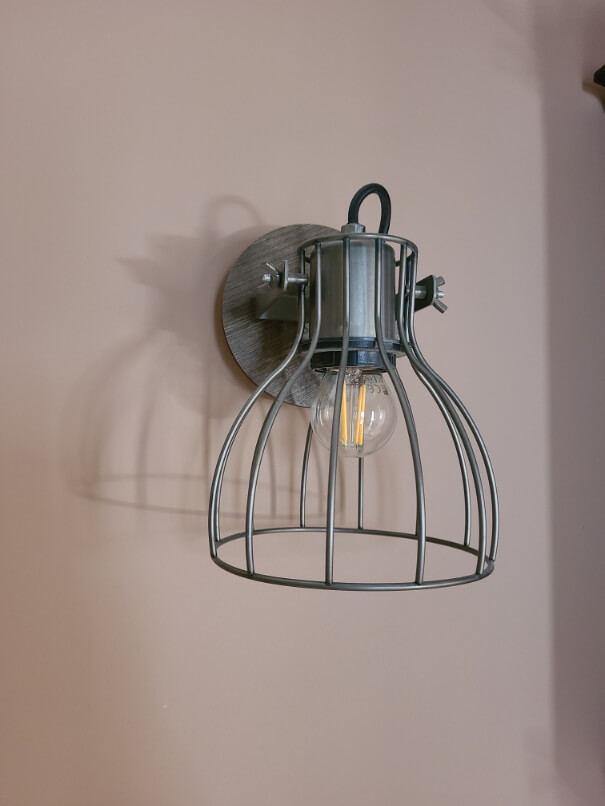 Redend Point on the walls behind a wire wall sconce