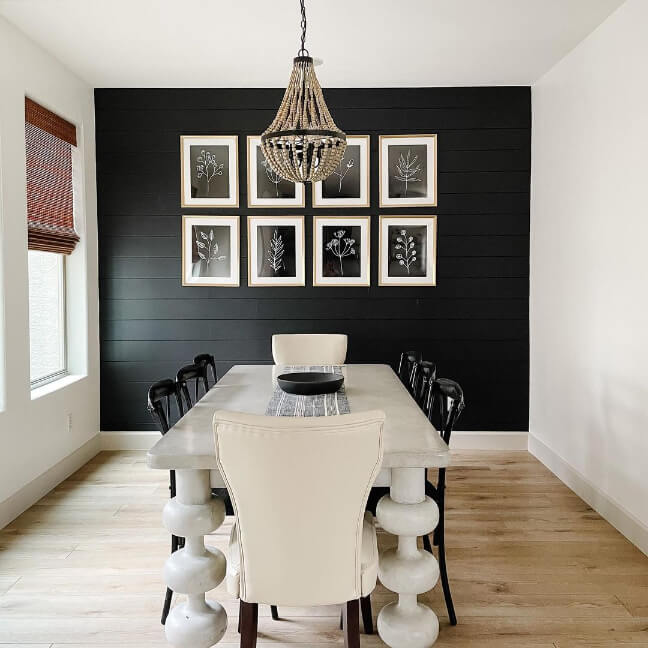 Black accent wall in a dining room with swiss coffee walls and accessible beige trim.