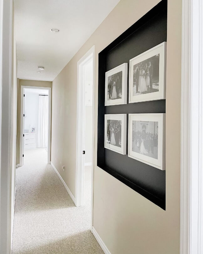 Accessible Beige in a hallway with Peppercorn in the alcoves and framed family photos.