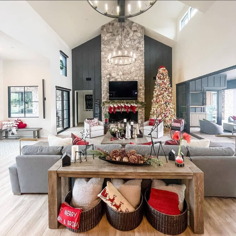 White Dove walls and ceiling in a grand vaulted living room with Iron Ore on an accent wall and seasonal christmas decor everywhere.