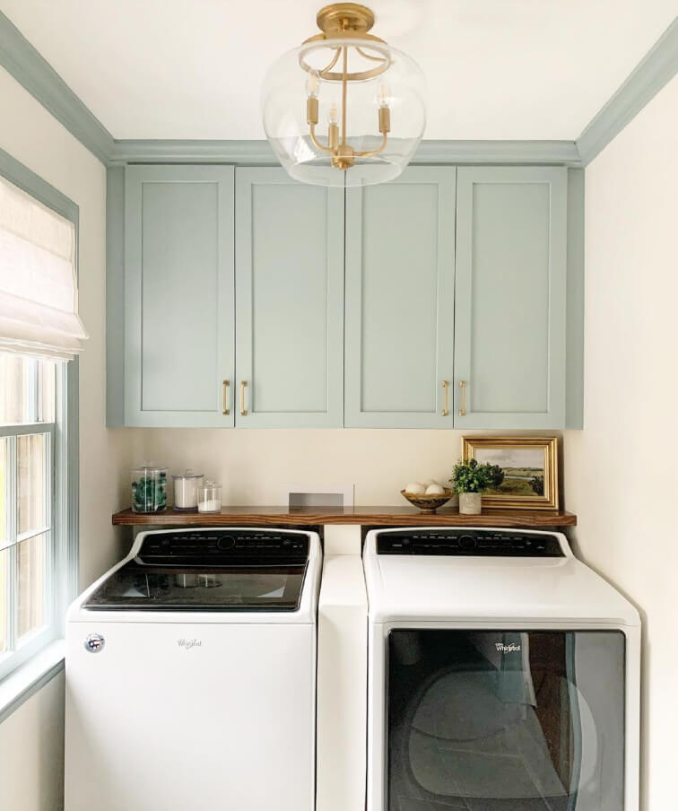 White Dove walls with Haze blue cabinets and trim in a laundry room