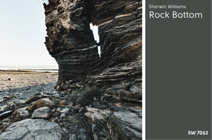 Rock Bottom swatched beside a tower of gray green slate