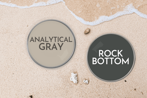 Paint lid of Rock Bottom on a beach beside a paint can lid of Coordinating color Analytical Gray