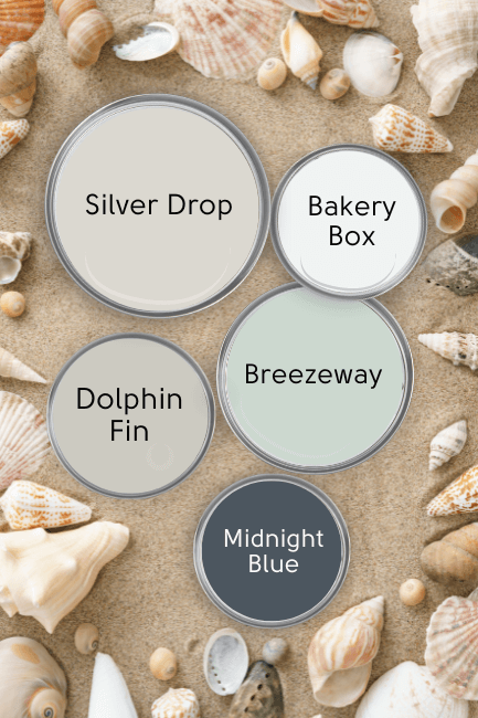 Behr Silver Drop in a color palette with Breezeway, Bakery Box, Dolphin Fin, and Midnight Blue over a background of a sandy beach with sea shells