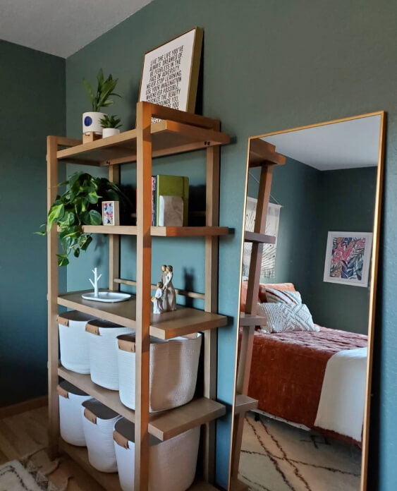 Sherwin Williams Succulent on bedroom walls behind a natural wood shelving unit