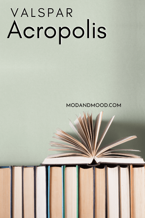 Valspar Acropolis on a wall behind a lineup of books