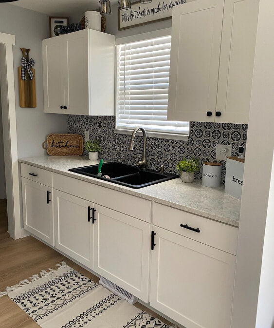 Behr White Metal on cabinets with gray walls and countertops.