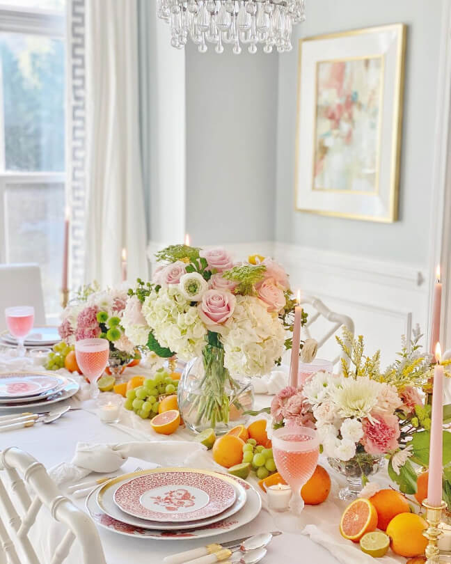 Behr Light French Gray looking silvery blue on dining room walls behind an elaborate table full of flowers and summer decor