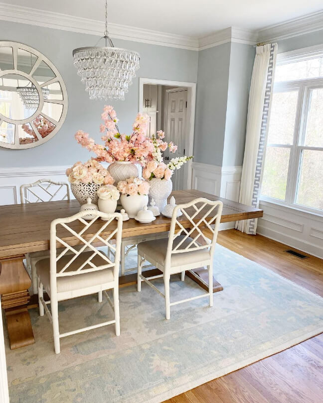 Behr Light French Gray on dining room walls with farmhouse style decor and pink flowers on the table