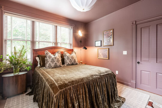Benjamin Moore Barberry color drench in a bedroom.