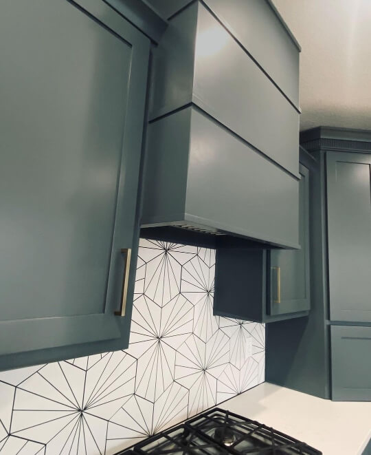 Grays Harbor cabinets with geometric backsplash tiles