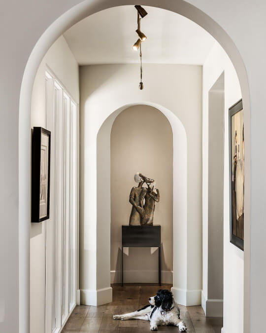 Sherwin Williams Creamy in an arched hallway