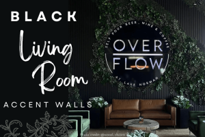 Black Living Room Accent Walls features a black wood slat wall covered in vines behind living room furniture with a neon cafe sign that reads "overflow" in the middle
